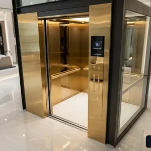 Báo giá thang máy 10 người trọn gói với thiết kế cabin inox gương phối kính cường lực